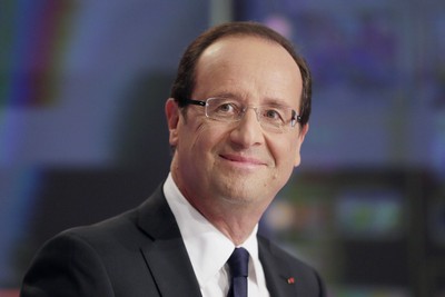 France's President Hollande poses after an interview during the evening broadcast news of French TV channel TF1 in Boulogne-Billancourt